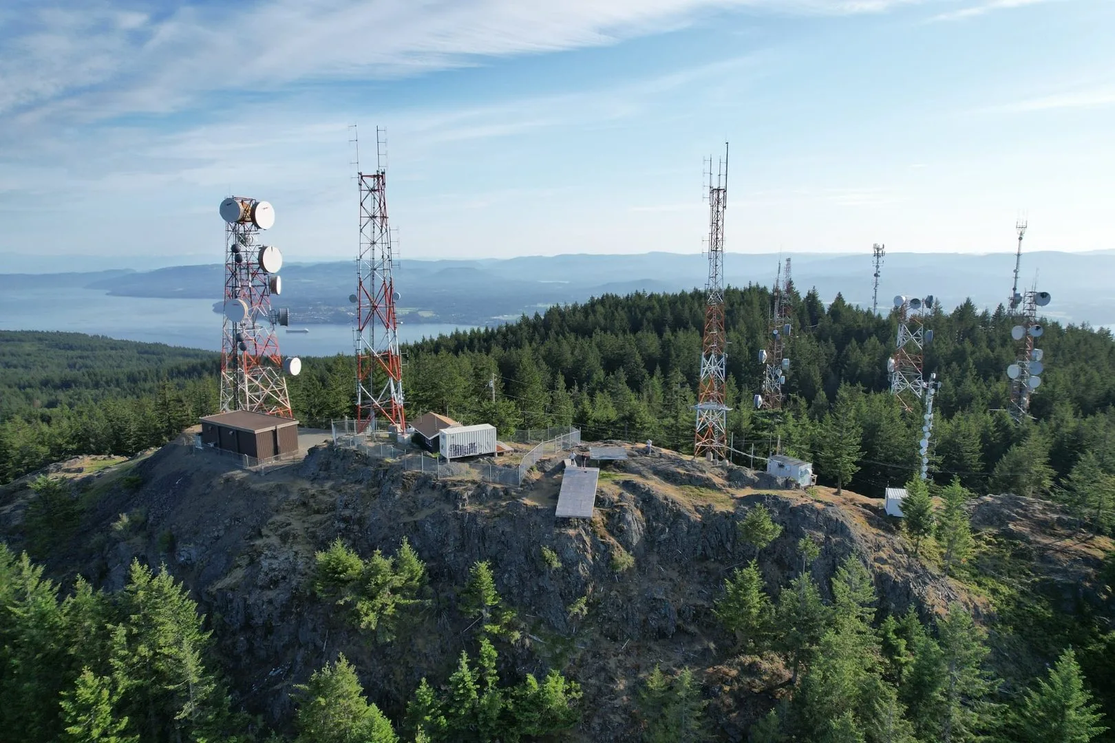 Mountain summit with multiple telecom towers
