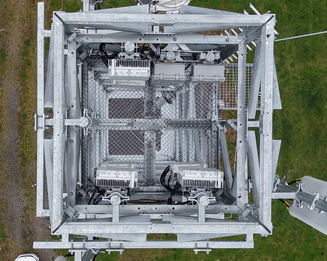 Top-down view of a lattice tower platform during inspection